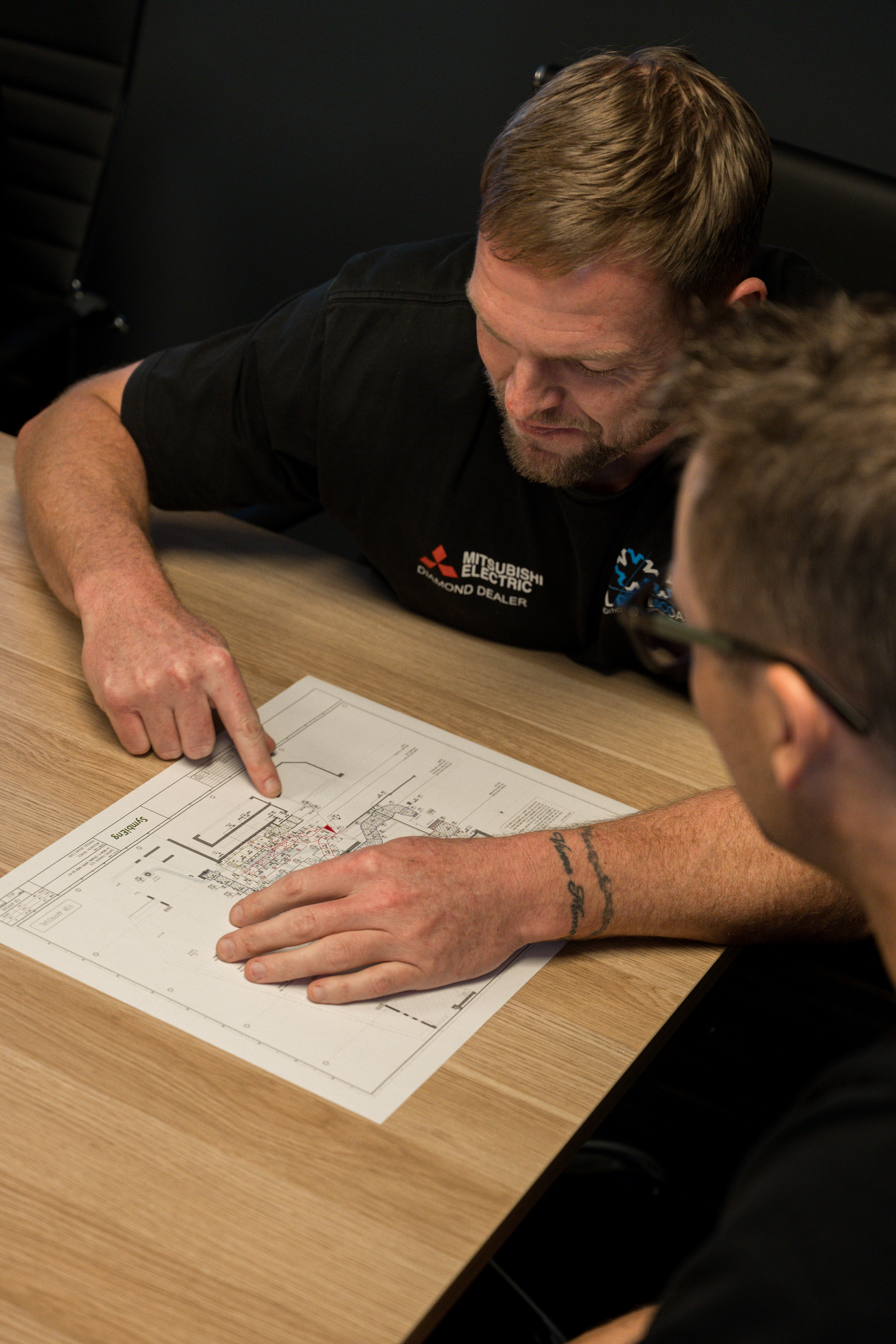 COLDCOAST technicians reviewing project plans on site